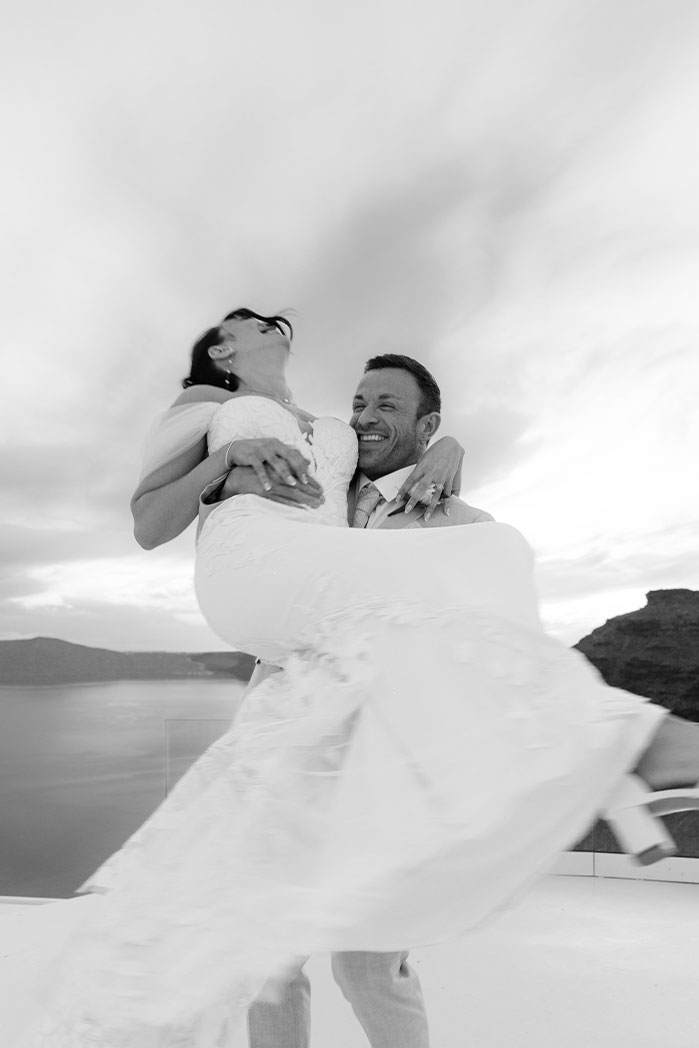 Hidden photographer capturing surprise proposal in Santorini