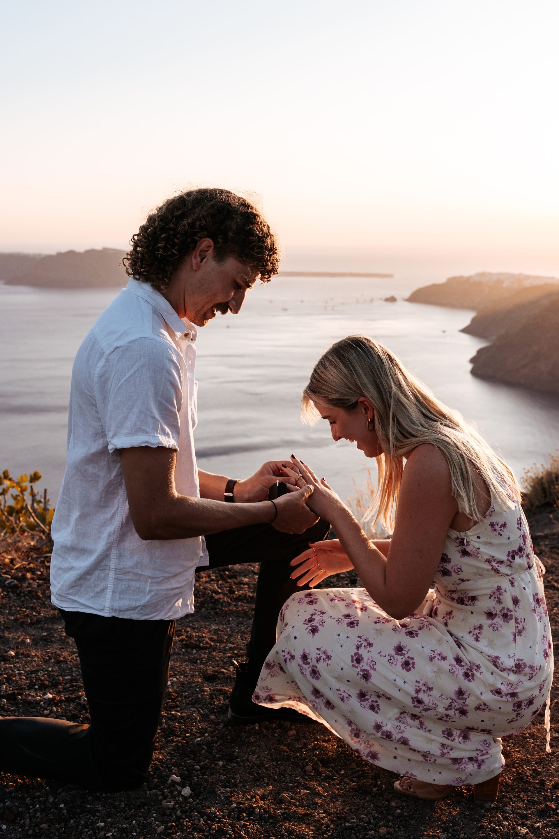 Surprise proposal photographed from a hidden position in Oia, Santorini